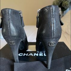 Classic Chanel Booties. Excellent Condition. Just A Tiny Nic On The Toe Of The Left Boot. Difficult To See In Pictures It’s So Tiny. Very Clean And Worn A Few Times. No Other Signs Of Wear. Comes With Box And Storage Bags. Pet And Smoke Free Home. 4 Inch Heel. No Trades. They Are All Black Pictures Show A Glare. All Sales Final Black Boots Chanel, Patent Leather Ankle-high Boots With Padded Heel, Chanel Black Ankle Boots, Chanel Booties, Chanel Ankle Boots, Luxury Ankle-high Patent Leather Heeled Boots, Black Picture, 4 Inch Heels, Chanel Shoes