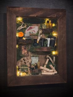 a wooden frame with various items in it