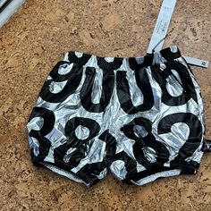 Silver With Black Numbers. Bubble Shorts With Elastic Waist And Hem. Has Pockets! Gender Neutral. Bubble Shorts, Black Numbers, Yoga Shorts, Kids Bottoms, Black Silver, Gender Neutral, Elastic Waist, Yoga, Elastic