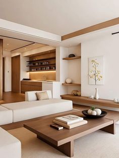 a living room filled with white furniture and wooden shelves