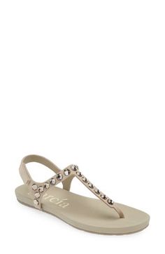 a women's sandal with studded straps and toe closures on the toes