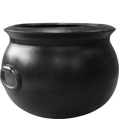 a large black pot with a handle on the side and a hole in the middle