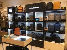 there are many bags on display in the store