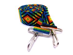 "These 48\" long multi-purpose beaded straps are a stunner! It's vibrant colors and brilliant glass beads make it unique and make it POP. Handmade with impeccable precision and detail, the straps can be re-purposed as a crossbody/purse strap, luggage strap, guitar bag strap, and even as a crossbody for your camera bag. With strong Native influences, these multi-functional straps are designed to make you feel bold and empowered! Length: 48\" Width: 1.25\" Handmade in Guatemala *Please note that a Travel Multicolor Beaded Shoulder Bag, Multicolor Beaded Crossbody Shoulder Bag, Multicolor Crossbody Shoulder Strap For Everyday Use, Guitar Strap Bag, Guitar Bag, Luggage Strap, Chic Bracelet, Handmade Wallets, Luggage Straps