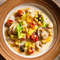 a white bowl filled with food on top of a wooden table