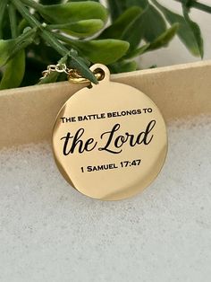 A beautiful 16K gold plated necklace engraved with "The Battle belongs to The Lord Bible Verse Gold Necklace, Christian Gifts, Scripture Jewelry, Personalized Quote Necklace, 1 Samuel 17:47 Charms are gold plated over stainless steel. Plated jewelry is a wonderful, affordable way to add a sophisticated look to your wardrobe, with the look of real gold. It is also an excellent choice for people with sensitive skin. CARE TIPS: Avoid contact with perfumes, body oils, and other chemicals, including Spiritual Gold Laser Engraved Jewelry, Spiritual Gold Jewelry Laser Engraved, Spiritual Laser Engraved Gold Jewelry, Gold Spiritual Jewelry Laser Engraved, Laser Engraved Spiritual Gold Jewelry, Inspirational Personalized Gold Jewelry, Gold Nameplate Necklace With Engraving Option, Gold Medallion Necklaces With Engraving Option, Gold Inspirational Jewelry For Gift