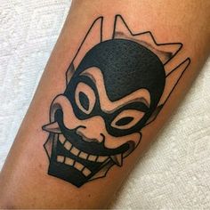 a person with a mask on their arm