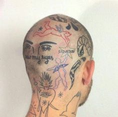 a man with many tattoos on his head