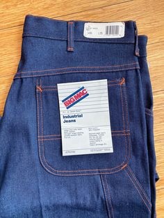 Rare deadstock vintage late 70's early 80's Big Mac industrial jeans. Classic painter pant style in dark denim with orange stitching. Wide pockets with lower side narrow tool pocket and hammer loop. Wide leg with slight taper. Features copper rivets and logo embossed snap at crotch. Heavy duty brass YKK zipper. 14+ ounce denim 64% cotton 36% polyester distributed by JCPenney new with tags size 36" waist 35-37"length. Painter Pants, Painters Pants, Big Mac, Pant Style, Ykk Zipper, Pants Jeans, Dark Denim, Jeans Pants, Denim Pants