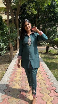 An Indo-Western Pathani kurta set for women with handwork is a fusion ensemble that blends traditional Indian and contemporary Western styles. The distinguishing feature of this outfit is the handwork and embellishments. This Indo-Western fusion comes in through modern design elements, cuts, or stylized patterns. This outfit is super comfortable and breathable yet stylish and elegant, giving perfect indian vibe with a hint of western touch. This indowestern kurta set,salwar kameez , coord set is perfect for all the occasions. Fitted Palazzo Set With Gota Work And Straight Kurta, Festive Straight Kurta Pant Set With Mirror Work, Festive Pant Set With Mirror Work And Straight Kurta, Designer Straight Kurta Pant Set With Mirror Work, Designer Pant Set With Mirror Work For Diwali, Cotton Long Sleeve Palazzo Set With Gota Work, Cotton Palazzo Set With Gota Work And Long Sleeves, Long Sleeve Cotton Palazzo Set With Gota Work, Anarkali Pant Set With Mirror Work And Long Sleeves