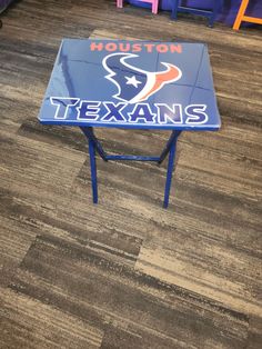 the houston texans logo is painted on an end table in a classroom at houston high school