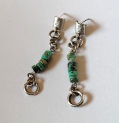 These fun turquoise dangle earrings are made out of sterling silver and Turquoise, perfect for everyday looks and comfortable to wear. They are 2.0 inches long. Post back. Earrings come with earring backs. Silver is oxidized and given a brushed finish to contrast with the turquoise color. All jewelry comes delivered in a gift box, ready to give as a gift if needed. Each piece of jewellery is hand-made so particular models may be slightly different from the ones on the photos. Please read our sho Modern Turquoise Nickel-free Earrings, Modern Turquoise Dangle Earrings, Modern Turquoise Hypoallergenic Earrings, Modern Hypoallergenic Turquoise Earrings, Silver Long Earrings, Hammered Bracelet, Turquoise Dangle Earrings, Modern Bracelets, Raw Crystal Necklace