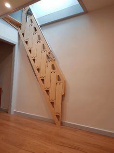 an empty room with a wooden stair case