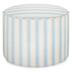 a light blue and white striped ottoman with an upholstered seat cover on top