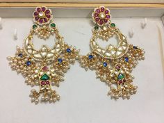 Indian Kundan Jewelry Designer Chandbali Earrings Ethnic wear Gold Tone Chand Bali for Indian Women and perfect match for all Bridal Outfits. *It's Handmade Indian Ethnic Kundan Designer Chandbali Earrings. *It's Multi Color Kundan Stones Settings and 22k gold Plating as shown in picture. *It is Real Kundan Design with Antique Touch and 3 inch long. *Our all jewelry is made from semiprecious stones and beads. *WARRANTY: ITS GENUINE HANDMADE JEWELRY AND WE ARE GIVING LONG LIFE WARRANTY FOR OUR AL Elegant Multicolor Pearl Earrings For Celebration, Traditional Multicolor Chandbali Pearl Earrings, Traditional Multicolor Pearl Drop Earrings, Multicolor Pearl Earrings For Celebrations, Festive Multicolor Pearl Drop Earrings, White Kundan Bohemian Earrings, Festive Multicolor Chandbali Pearl Earrings, Bohemian White Kundan Earrings, Multicolor Drop Pearl Earrings For Wedding