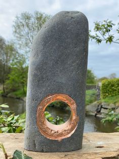 a rock with a copper ring on it