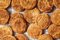 a bunch of cookies that are on a wire rack