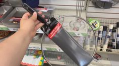 a person is using a knife to cut through a piece of paper on a wire rack