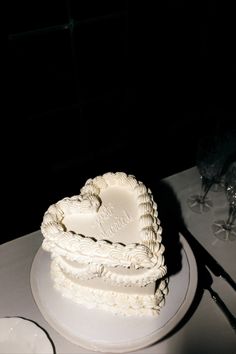 a heart shaped cake sitting on top of a table