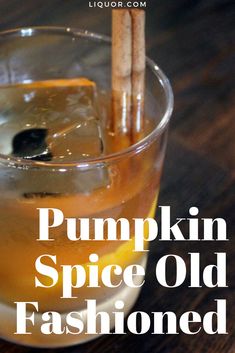 pumpkin spice old fashioned cocktail in a glass with two cinnamon sticks sticking out of it