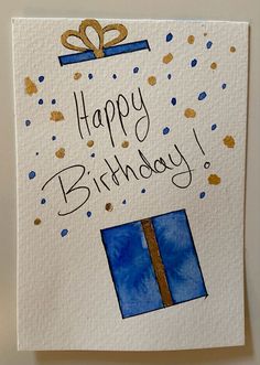 a handmade birthday card with a blue gift box