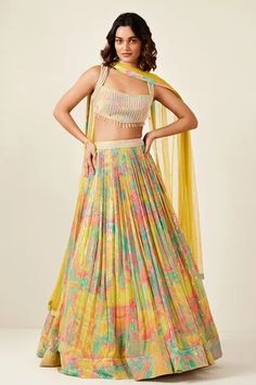 Multicolor A-line flared pleated lehenga with abstract flower print base and sequin embellishments. Paired with a blouse, adorned with crystal embellished blouse and dupatta.
Components: 3
Pattern: Print,Embellished
Type Of Work: Floral,Sequin,Crystal
Neckline: Square Neck
Sleeve Type: Sleeveless
Fabric: Georgette Soft Net: Dupatta
Color: Multi Color
Other Details: 

Occasion: Sangeet,Wedding - Aza Fashions Sequins Lehenga, Abstract Flower Pattern, Haldi Outfits, Spring Colours, Yellow Soft, Lehenga Online, Vacuum Storage, Lehenga Collection, Embellished Blouse