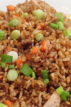 rice with meat and vegetables in a white bowl