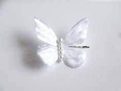 Elegant hair pin, butterfly is made from fabric and pearl beads, attached to bobby pin. Butterfly measures about 3.25 inches/ 8 cm wide and 3 inches/7.5 cm long. My home is a smoke-free and pet-free. Have a custom request, please contact me. White Butterfly Accessories, Butterfly Hair Pin, Butterfly Accessories, Monterey Ca, Elegant Hair, Bobby Pin, Hair Jewelry Wedding, Butterfly Hair, White Butterfly