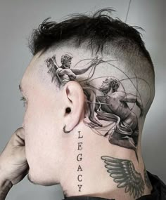 a man with tattoos on his head and behind his ear is looking at the back of his head