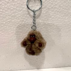 a monkey keychain hanging on the wall