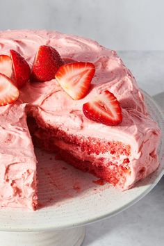 a strawberry cake with one slice cut out