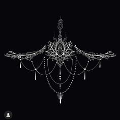 a chandelier hanging from the ceiling in front of a black background with an intricate design