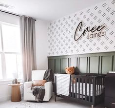 a baby's room with a crib and chair