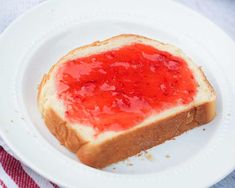 a piece of bread with ketchup on it