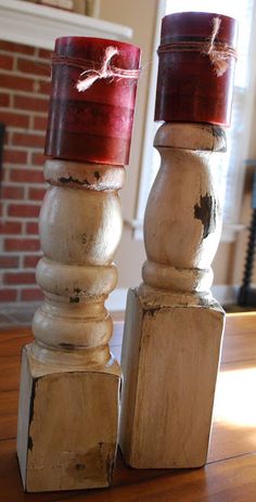 two wooden candlesticks sitting on top of a table