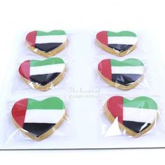 heart shaped cookies decorated with the flag of united arab emirates