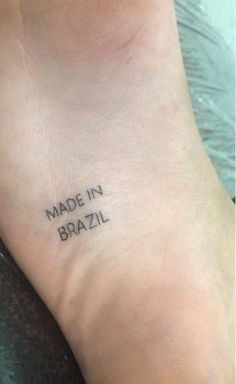 a small tattoo on the ankle that says made in brazil