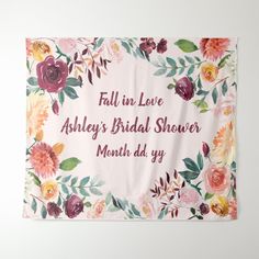 a floral banner with the words fall in love ashley's bridal shower month