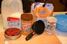 the ingredients to make an ice cream dessert are displayed on a counter top, including milk, sugar, and other items