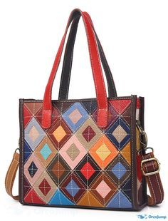 a multicolored handbag with leather handles and straps on the front, featuring an abstract design