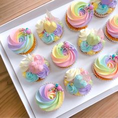 there are many cupcakes with different colors on them