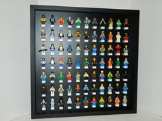 a black framed display with lego minifigures on it's sides and bottom