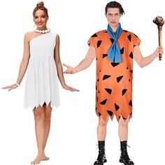 two people dressed in costumes standing next to each other