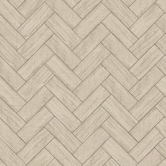 an image of a wood floor textured in beige tones with diagonal herringbones