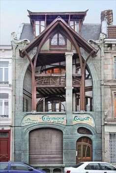 an old building that has been converted into a restaurant and is being used as a parking lot