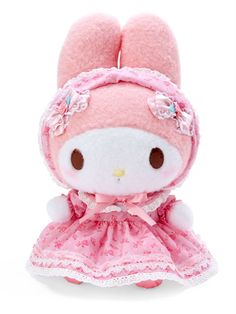 a small stuffed animal wearing a pink dress