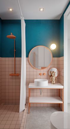 a bathroom with pink and blue walls, tiled flooring and a round mirror on the wall