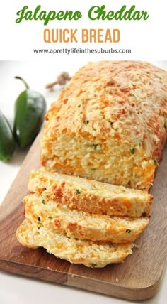 a loaf of italian cheddar quick bread on a cutting board