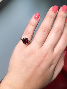 Classic Prong Set Large Garnet Solitaire Proposal/ Engagement Ring. Material: 14K Yellow Gold Finish: High Polished/ Shiny Fit: Standard with Rounded Exterior Weight: apx 4.2gr. Width: 2mm Height: 2mm Stone: Natural Garnet Quality: AAA Center Stone: 10mm Carat Weight: apx. 4.2ct. Shape & Cut: Round, Diamond Cut Height Above Finger: 7mm Setting: Prong Set 4 Eagle Claw Prongs Many choose a solitaire setting for its classic elegance and its ability to showcase the beauty of the single stone. Th Fine Jewelry Birthstone Ring For Proposal, Garnet Brilliant Cut Ring As Gift, Garnet Rings With Brilliant Cut In Fine Jewelry Style, Garnet Rings In Brilliant Cut Fine Jewelry, Garnet Rings With Brilliant Cut Fine Jewelry, Fine Jewelry Garnet Rings With Brilliant Cut, Classic Red Sapphire Promise Ring, Round Cut Jewelry With Accent Stones For Proposal, Fine Jewelry Gemstone Rings For Proposal