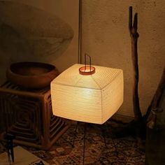 a lamp sitting on top of a wooden table